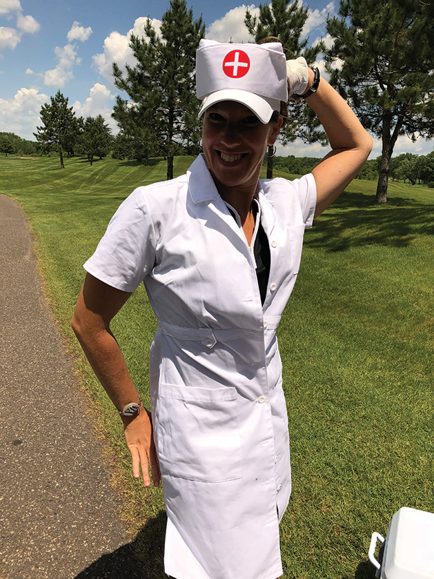Good sport Brooke Dusk landed on “play a nurse,” during a spin the wheel challenge at the Hudson Hospital Golf Tournament