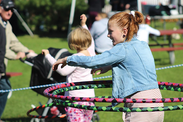Children hula hoop at the 2019 Spirit of the St. Croix Art Festival