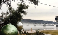 An ornamented tree sits in the foreground in front of the Stillwater Life Bridge