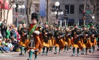 A parade marches down the street as part of The Episcopal Church of the Ascension’s Bagpipes & Bonfires event.