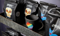 Colectivo Coffee Bags of Colectivo Coffee sit next to a Wisconsin mug at The Purple Tree gift shop.