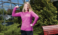 Kelly Fox, director of healthy living at the Hudson YMCA, flexes her muscles.