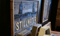 A wood-carved Stillwater Bridge sign from Smith + Trade Mercantile