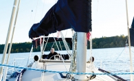 J.R. Hunter's sailboat sailing on the St. Croix River. Hunter docks the boat at Bayport Marina.