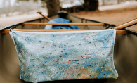 A durable fabric map from True North Map Company is affixed to a canoe during a Boundary Waters trip.
