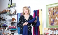 Shannon Enright Shannon Enright, owner of Small Things Fair Trade, shows off some of her wares.