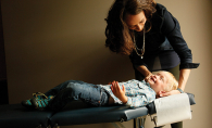 A chiropractor from Croixview Family Chiropractic works on a patient.