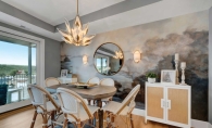 Dining room featuring a gray wall mural.