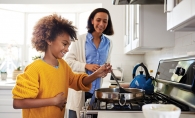 helping cook in the kitchen