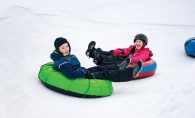 children snow tubing