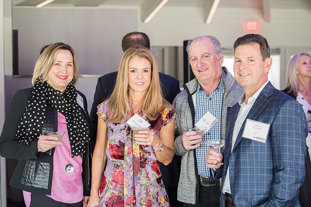 Guests pose for a photo at United by the Vine 2019