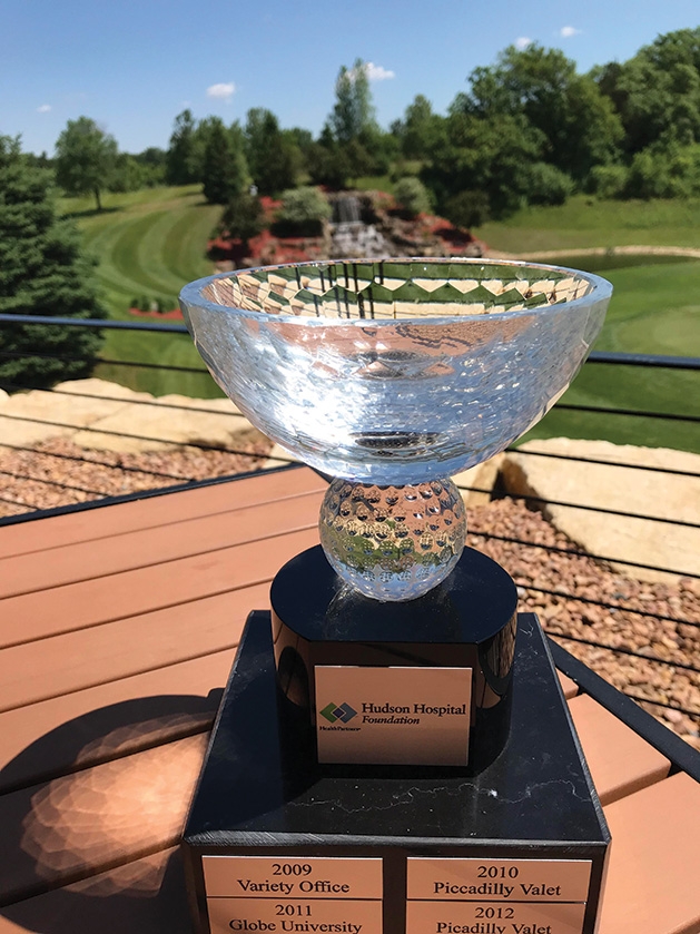The Challenge Cup is awarded to the team at the Hudson Hospital Golf Tournamentthat has the best score in an industry. Picadilly Valet won the retail industry trophy