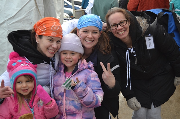 A family poses at the St. Croix River Dunk