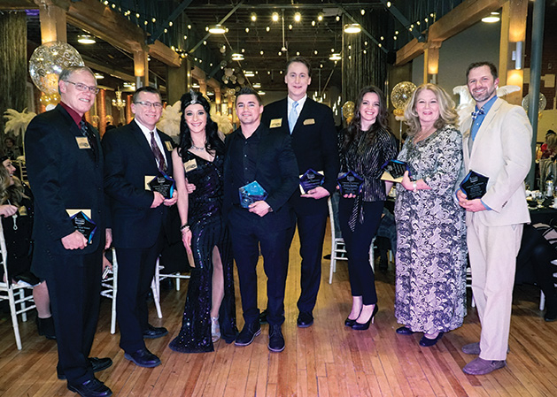 Attendees at the Stillwater Chamber Gala pose for a photo.
