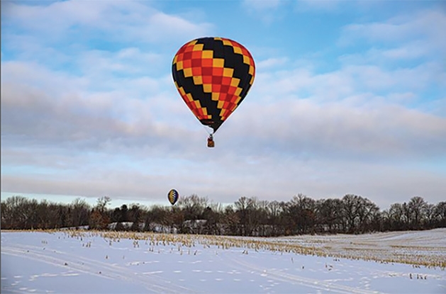 A hot air balloon in the sky at Hudson Hot Air Affair 2020
