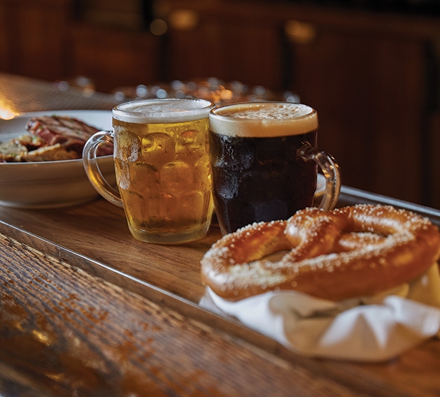 Winzer Stube Oktoberfest Traditional German beers and a pretzel at the Winzer Stube's Oktoberfest celebration.
