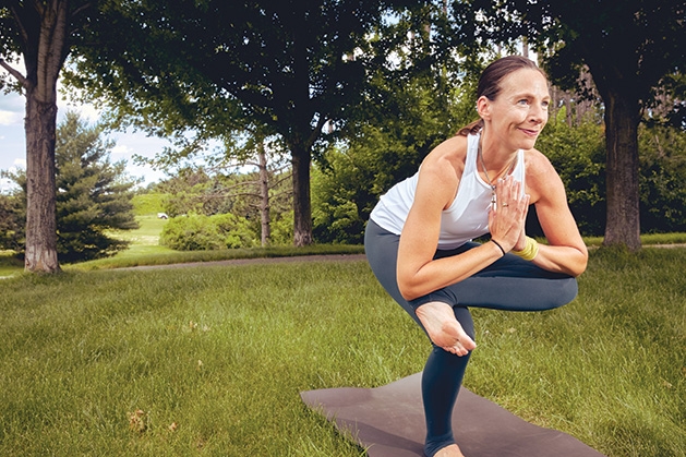 Instructor Jess Alenov teaches a yoga class at Riverfront Athletic Club