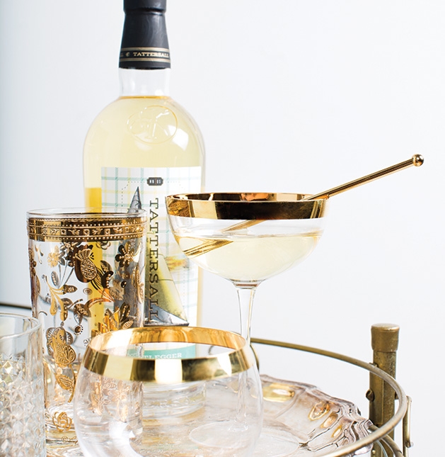 Aperitifs and digestifs A bottle of liquor from Tattersall Distilling sits on a bar cart with an aperitif.