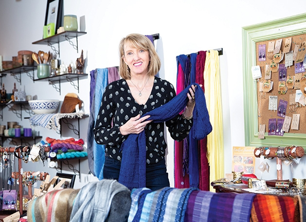 Shannon Enright, owner of Small Things Fair Trade, shows off some of her wares.