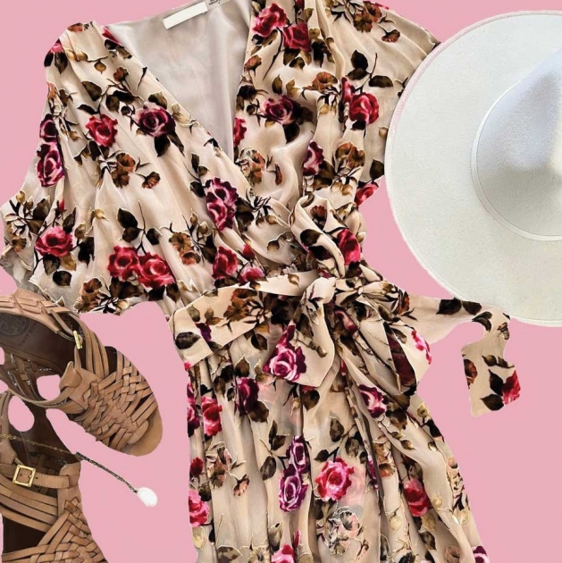 Styled set featuring a floral dress, white hat and brown sandals.