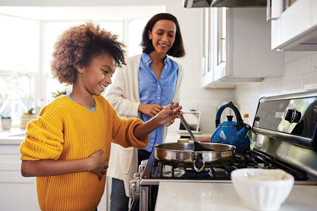 helping cook in the kitchen