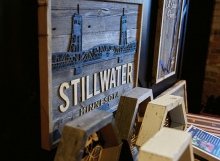 A wood-carved Stillwater Bridge sign from Smith + Trade Mercantile