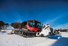 A grooming machine on the slopes at Wild Mountain