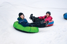 children snow tubing