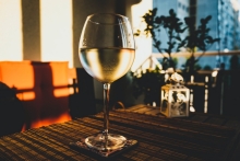 Wine glass in a well-lit kitchen.