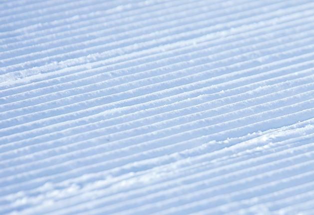 A smoothly groomed ski hill