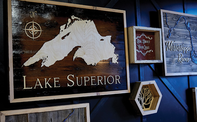 A custom wooden Lake Superior map on display at Smith + Trade Mercantile.