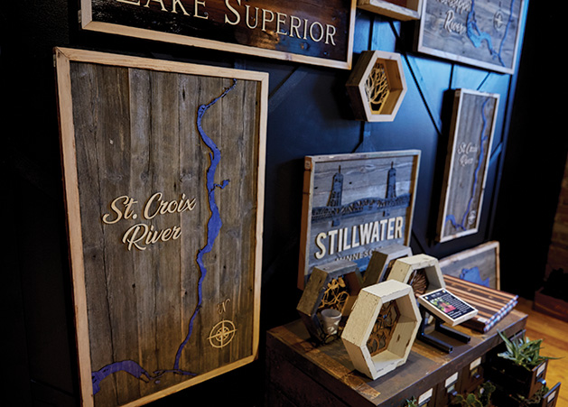 A custom wooden St. Croix River map on display at Smith + Trade Mercantile